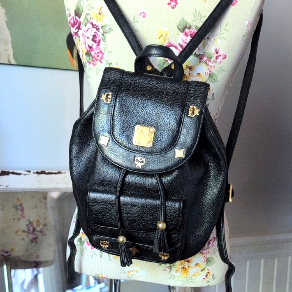 MCM‎ Vintage black backpack with golden studded logo motif
